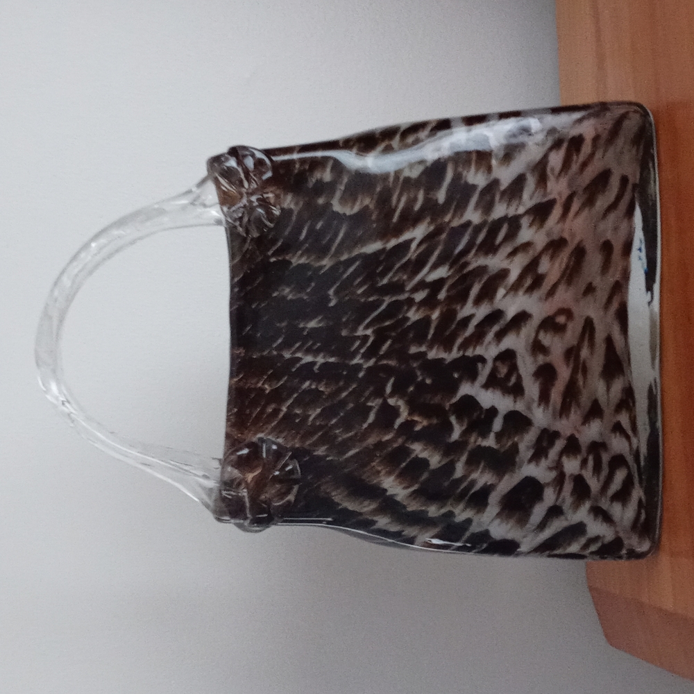 Glass purse 8 inches by 7 and half. Clear and brown in color.